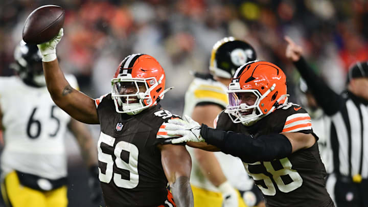 Nov 21, 2024; Cleveland, Ohio, USA; Cleveland Browns linebacker Jordan Hicks (58) and linebacker Winston Reid (59) celebrate after Reid recovered a fumble during the first half against the Pittsburgh Steelers at Huntington Bank Field. Mandatory Credit: Ken Blaze-Imagn Images