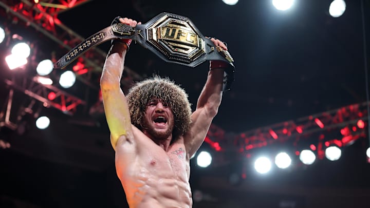 Jun 7, 2025; Newark, New Jersey, UNITED STATES; Merab Dvalishvili (red gloves) reacts after defeating Sean O’Malley (not pictured) in a bantamweight title fight during UFC 316 at Prudential Center. Mandatory Credit: Vincent Carchietta-Imagn Images Jun 7, 2025; Newark, New Jersey, UNITED STATES; Merab Dvalishvili (red gloves) reacts after defeating Sean O’Malley (not pictured) in a bantamweight title fight during UFC 316 at Prudential Center. Mandatory Credit: Vincent Carchietta-Imagn Images