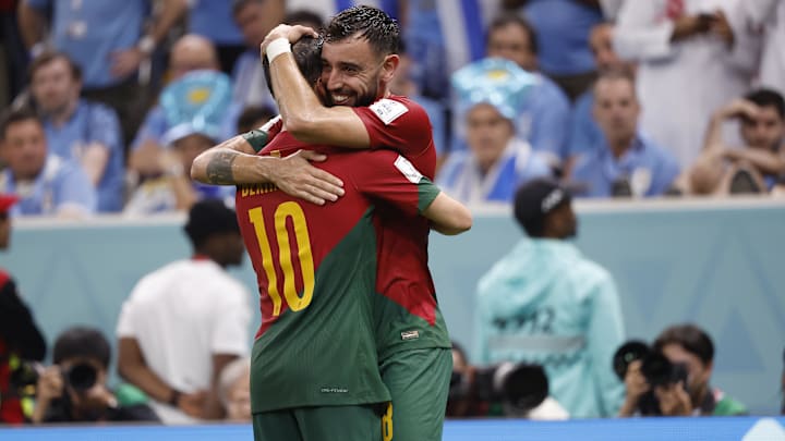 Nov 28, 2022; Lusail, Qatar; Portugal midfielder Bruno Fernandes (8) celebrates his penalty kick goal scored against Uruguay with midfielder Bernardo Silva (10) during the second half of the group stage match in the 2022 World Cup at Lusail Stadium. Mandatory Credit: Yukihito Taguchi-Imagn Images