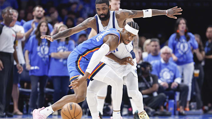 May 9, 2024; Oklahoma City, Oklahoma, USA; Oklahoma City Thunder guard Shai Gilgeous-Alexander (2) loses control of the ball in front of Dallas Mavericks guard Kyrie Irving (11) during the second half of game two of the second round for the 2024 NBA playoffs at Paycom Center. Mandatory Credit: Alonzo Adams-Imagn Images