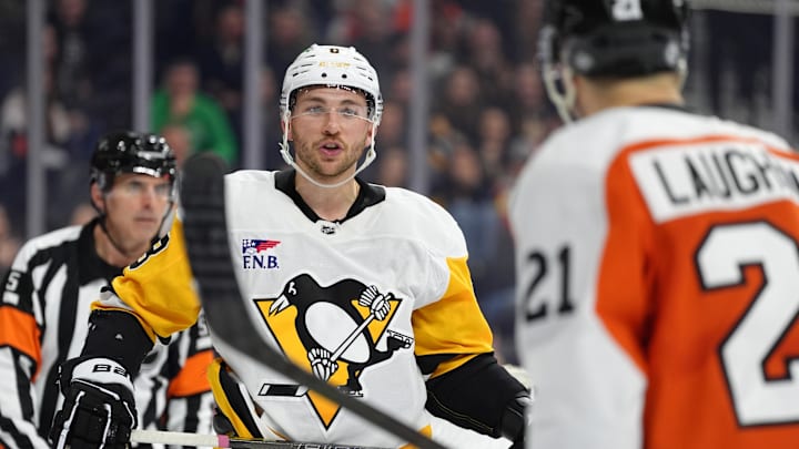 Feb 8, 2025; Philadelphia, Pennsylvania, USA; Pittsburgh Penguins left wing Michael Bunting (8) reacts to Philadelphia Flyers center Scott Laughton (21) in the third period at Wells Fargo Center. Mandatory Credit: Kyle Ross-Imagn Images