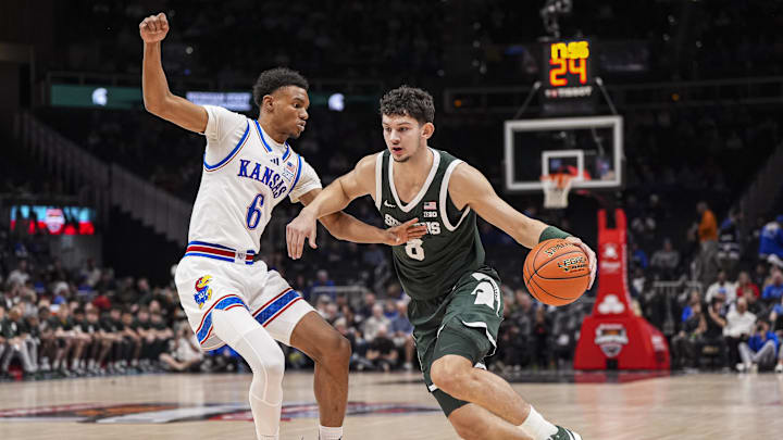 Nov 12, 2024; Atlanta, Georgia, USA; Kansas Jayhawks guard Rylan Griffen (6) guards Michigan State Spartans forward Frankie Fidler (8) during the first half at State Farm Arena. Mandatory Credit: Dale Zanine-Imagn Images