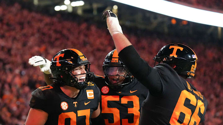 Nov 2, 2024; Knoxville, Tennessee, USA; Tennessee tight end Miles Kitselman (87) celebrates with offensive lineman Lance Heard (53) and offensive lineman Dayne Davis (66) after scoring a touchdown against the Kentucky Wildcats during the first half at Neyland Stadium. Mandatory Credit: Angelina Alcantar/USA TODAY Network via Imagn Images Nov 2, 2024; Knoxville, Tennessee, USA; Tennessee tight end Miles Kitselman (87) celebrates with offensive lineman Lance Heard (53) and offensive lineman Dayne Davis (66) after scoring a touchdown against the Kentucky Wildcats during the first half at Neyland Stadium. Mandatory Credit: Angelina Alcantar/USA TODAY Network via Imagn Images