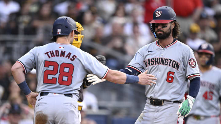 Jun 25, 2024; San Diego, California, USA; Washington Nationals left fielder Jesse Winker (6) is congratulated by right fielder Lane Thomas (28) after hitting a two-run home run against the San Diego Padres during the third inning at Petco Park.