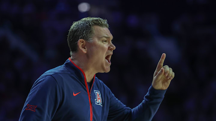 Feb 11, 2025; Manhattan, Kansas, USA; Arizona Wildcats head coach Tommy Lloyd yells at his team during the first half against the Kansas State Wildcats at Bramlage Coliseum. Mandatory Credit: Scott Sewell-Imagn Images