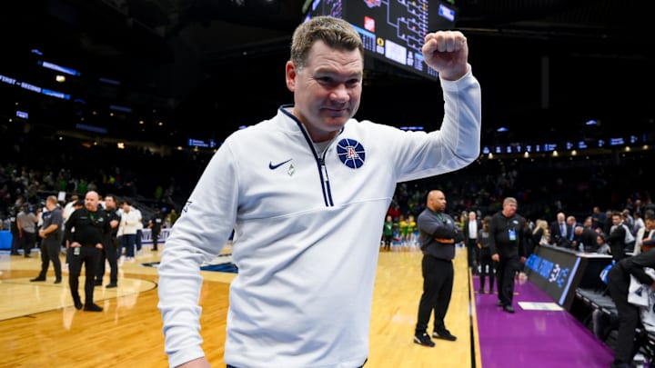 Mar 23, 2025; Seattle, WA, USA;  Arizona Wildcats head coach Tommy Lloyd celebrates after defeating the Oregon Ducks at Climate Pledge Arena. Mandatory Credit: Stephen Brashear-Imagn Images