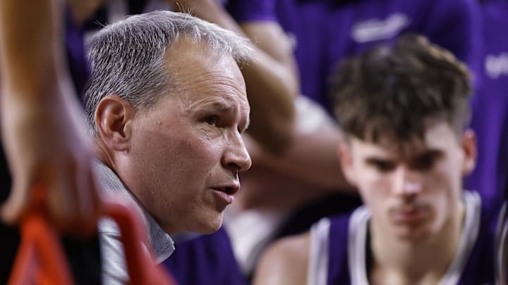 Jan 19, 2025; Ann Arbor, Michigan, USA;  Northwestern Wildcats head coach Chris Collins talks to his players during a time out in the first half against the Michigan Wolverines at Crisler Center. Mandatory Credit: Rick Osentoski-Imagn Images