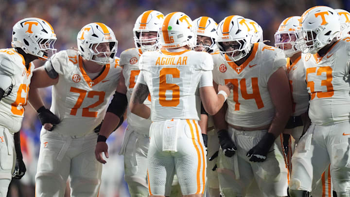 Tennessee quarterback Joey Aguilar (6) huddles with the offensive line during an NCAA college football game against Florida on November 22, 2025, in Gainesville, Florida. Tennessee quarterback Joey Aguilar (6) huddles with the offensive line during an NCAA college football game against Florida on November 22, 2025, in Gainesville, Florida.