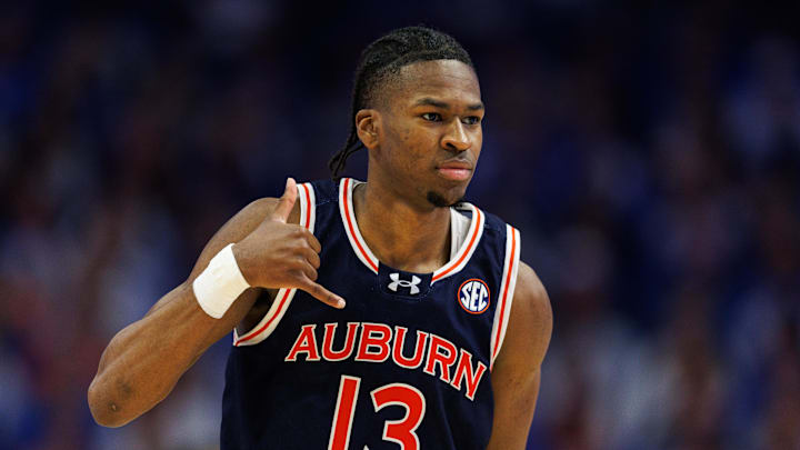 Mar 1, 2025; Lexington, Kentucky, USA; Auburn Tigers guard Miles Kelly (13) celebrates after making a three point basket during the second half against the Kentucky Wildcats at Rupp Arena at Central Bank Center. Mandatory Credit: Jordan Prather-Imagn Images