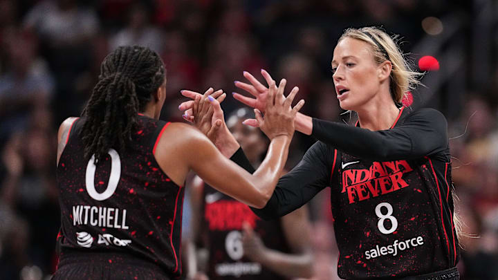 Indiana Fever guard Sophie Cunningham (8) high-fives Indiana Fever guard Kelsey Mitchell (0) on Tuesday, Aug. 12, 2025, during the game at Gainbridge Fieldhouse in Indianapolis.
