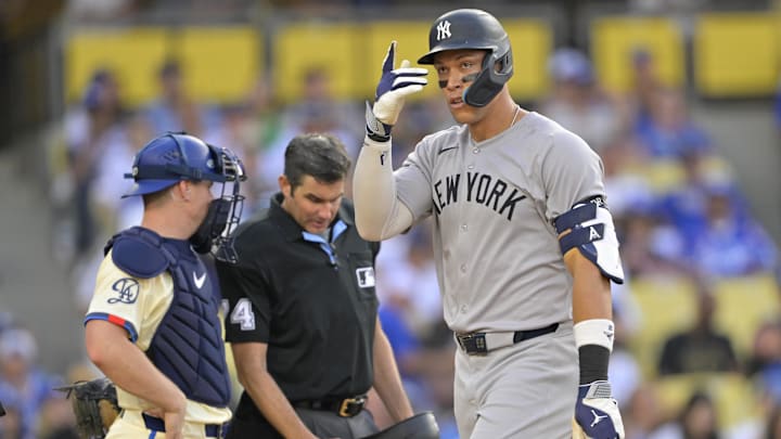 May 31, 2025; Los Angeles, California, USA;  New York Yankees right fielder Aaron Judge (99) crosses the plate after hitting his second solo home run of the game in the eighth inning against the Los Angeles Dodgers at Dodger Stadium. Mandatory Credit: Jayne Kamin-Oncea-Imagn Images