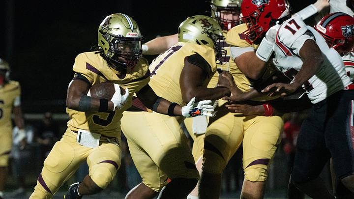 Josiah Bataille, #5, of the Riverdale High School football team gains yards against South Fort Myers at Riverdale on Thursday, Aug. 27, 2026. South Fort Myers won. Josiah Bataille, #5, of the Riverdale High School football team gains yards against South Fort Myers at Riverdale on Thursday, Aug. 27, 2026. South Fort Myers won.