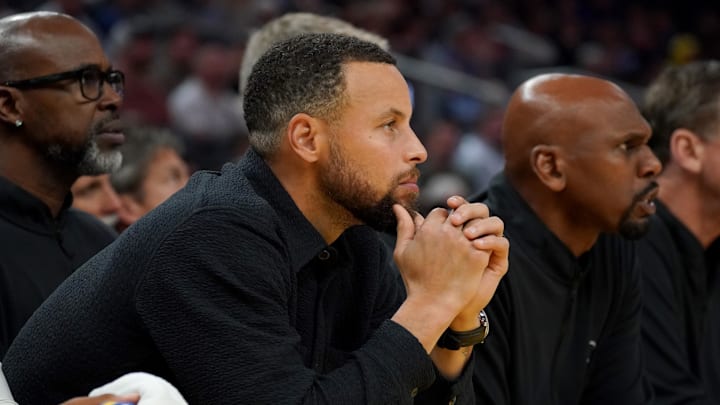 Golden State Warriors guard Stephen Curry (30) sits on the bench injured during the second quarter against the New Orleans Pelicans at Chase Center.