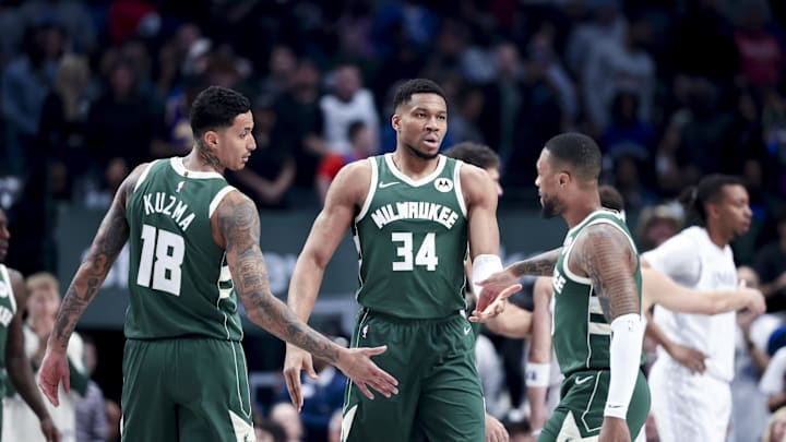 Mar 1, 2025; Dallas, Texas, USA;  Milwaukee Bucks forward Giannis Antetokounmpo (34) celebrates with Milwaukee Bucks guard Damian Lillard (0) and Milwaukee Bucks forward Kyle Kuzma (18) against the Dallas Mavericks during the first half at American Airlines Center. Mandatory Credit: Kevin Jairaj-Imagn Images