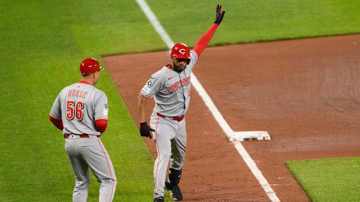 Apr 18, 2025; Baltimore, Maryland, USA; Cincinnati Reds third baseman Jeimer Candelario (3) celebrated with third base coach J.R. House (56) during the seventh inning against the Baltimore Orioles at Oriole Park at Camden Yards. Mandatory Credit: Reggie Hildred-Imagn Images
