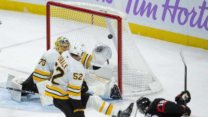 Nov 13, 2025; Ottawa, Ontario, CAN; Ottawa Senators center Tim Stutzle (18) scores against Boston Bruins goalie Joonas Korpisalo (70) in the third period at the Canadian Tire Centre. Mandatory Credit: Marc DesRosiers-IMAGN Images