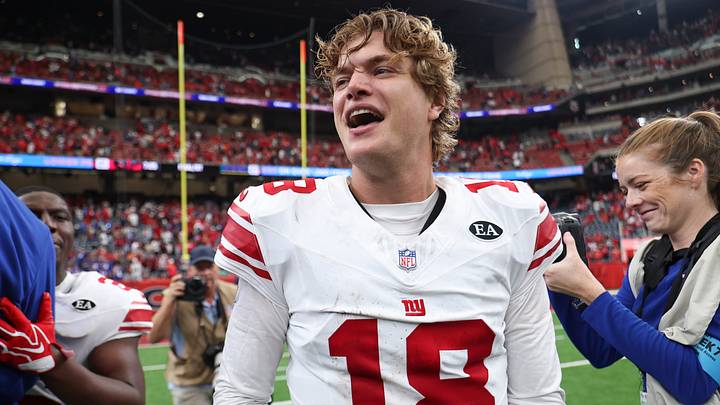 New York Giants quarterback J.J. McCarthy (18) smiles after the game against the Houston Texans at Reliant Stadium. New York Giants quarterback J.J. McCarthy (18) smiles after the game against the Houston Texans at Reliant Stadium.