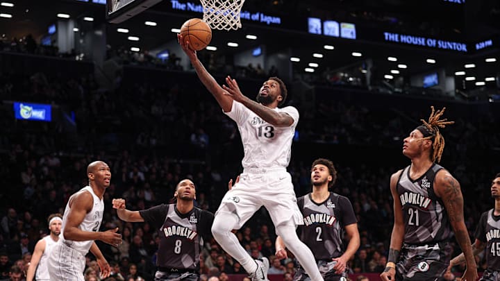 Mar 24, 2025; Brooklyn, New York, USA; Dallas Mavericks forward Naji Marshall (13) goes to the basket against Brooklyn Nets forward Cameron Johnson (2) and forward Noah Clowney (21) during the second half at Barclays Center. Mandatory Credit: Vincent Carchietta-Imagn Images Mar 24, 2025; Brooklyn, New York, USA; Dallas Mavericks forward Naji Marshall (13) goes to the basket against Brooklyn Nets forward Cameron Johnson (2) and forward Noah Clowney (21) during the second half at Barclays Center. Mandatory Credit: Vincent Carchietta-Imagn Images