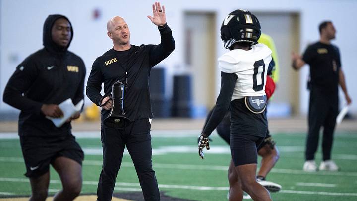 Vanderbilt Coach Clark Lea high-fives cornerback Cobey Sellers (0) during preseason practice at the school’s indoor facility Friday, Aug. 14, 2026. Vanderbilt Coach Clark Lea high-fives cornerback Cobey Sellers (0) during preseason practice at the school’s indoor facility Friday, Aug. 14, 2026.
