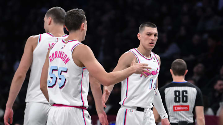 Jan 25, 2025; Brooklyn, New York, USA; Miami Heat guard Tyler Herro (14) reacts with forward Duncan Robinson (55) during the second half against the Brooklyn Nets at Barclays Center. Mandatory Credit: John Jones-Imagn Images