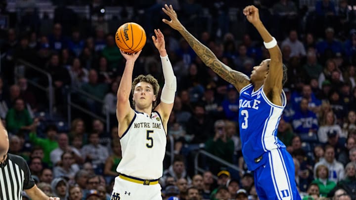 Feb 24, 2026; South Bend, Indiana, USA; Notre Dame Fighting Irish guard Cole Certa (5) shoots as Duke Blue Devils guard Isaiah Evans (3) defends during the first half at Purcell Pavilion at the Joyce Center. Mandatory Credit: Michael Caterina-Imagn Images Feb 24, 2026; South Bend, Indiana, USA; Notre Dame Fighting Irish guard Cole Certa (5) shoots as Duke Blue Devils guard Isaiah Evans (3) defends during the first half at Purcell Pavilion at the Joyce Center. Mandatory Credit: Michael Caterina-Imagn Images