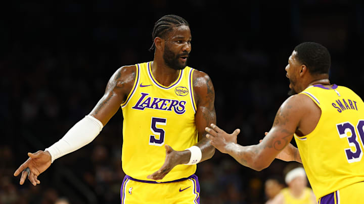 Feb 26, 2026; Phoenix, Arizona, USA; Los Angeles Lakers center Deandre Ayton (5) talks with guard Marcus Smart (36) against the Phoenix Suns at Mortgage Matchup Center. Mandatory Credit: Mark J. Rebilas-Imagn Images