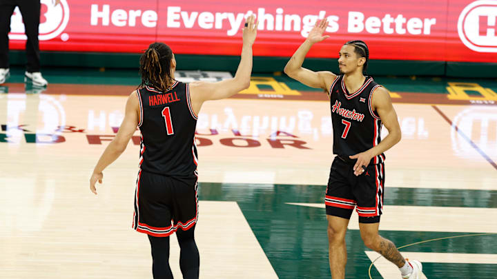 Jan 10, 2026; Waco, Texas, USA; Houston Cougars guard Isiah Harwell (1) and Houston Cougars guard Milos Uzan (7) celebrate after a play during the first half against the Baylor Bears at Paul and Alejandra Foster Pavilion. Mandatory Credit: Chris Jones-Imagn Images