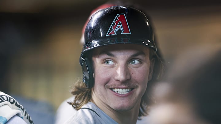 Sep 8, 2024; Houston, Texas, USA; Arizona Diamondbacks center fielder Jake McCarthy (31) smiles in the dugout after scoring during the second inning against the Houston Astros at Minute Maid Park. Mandatory Credit: Troy Taormina-Imagn Images