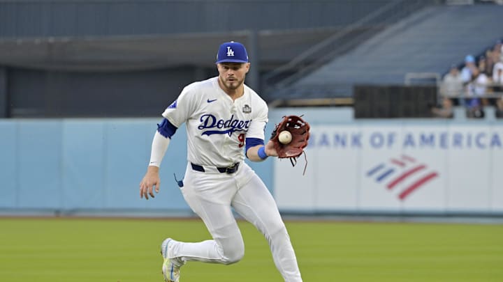 Oct 25, 2024; Los Angeles, California, USA; Los Angeles Dodgers second baseman Gavin Lux (9) fields a ball in the second inning against the New York Yankees during game one of the 2024 MLB World Series at Dodger Stadium. Mandatory Credit: Jayne Kamin-Oncea-Imagn Images