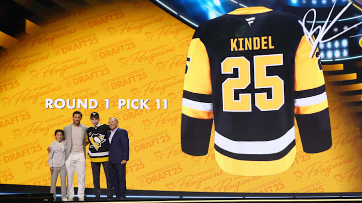 Alex Letang (far left), Kris Letang (left) Benjamin Kindel (middle) Gary Bettman (right) stand on Peacock Theatre stage at 2025 NHL Draft