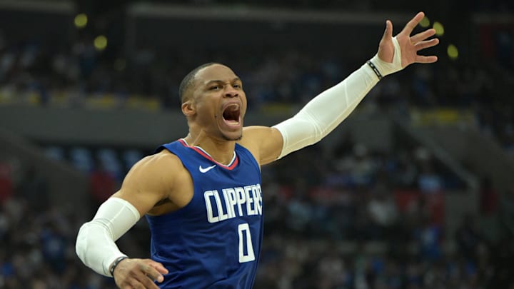 Apr 21, 2024; Los Angeles, California, USA; Los Angeles Clippers guard Russell Westbrook (0) celebrates after a dunk on a pass from guard James Harden (1) in the first half during game one of the first round for the 2024 NBA playoffs against the Dallas Mavericks at Crypto.com Arena. Mandatory Credit: Jayne Kamin-Oncea-Imagn Images Apr 21, 2024; Los Angeles, California, USA; Los Angeles Clippers guard Russell Westbrook (0) celebrates after a dunk on a pass from guard James Harden (1) in the first half during game one of the first round for the 2024 NBA playoffs against the Dallas Mavericks at Crypto.com Arena. Mandatory Credit: Jayne Kamin-Oncea-Imagn Images
