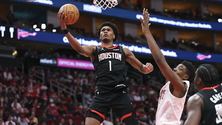 Dec 27, 2025; Houston, Texas, USA;  Houston Rockets guard Amen Thompson (1) attempts to score a basket during the third quarter against the Cleveland Cavaliers at Toyota Center. Mandatory Credit: Troy Taormina-Imagn Images