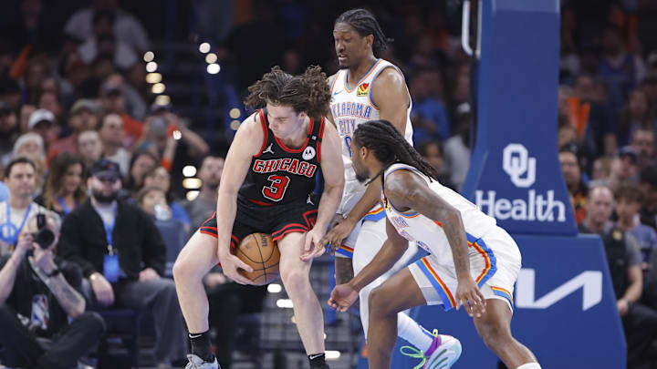 Mar 31, 2025; Oklahoma City, Oklahoma, USA; Chicago Bulls guard Josh Giddey (3) works to control the ball as Oklahoma City Thunder guard Cason Wallace (22) and forward Jalen Williams (8) defend the play during the second quarter at Paycom Center. Mandatory Credit: Alonzo Adams-Imagn Images Mar 31, 2025; Oklahoma City, Oklahoma, USA; Chicago Bulls guard Josh Giddey (3) works to control the ball as Oklahoma City Thunder guard Cason Wallace (22) and forward Jalen Williams (8) defend the play during the second quarter at Paycom Center. Mandatory Credit: Alonzo Adams-Imagn Images