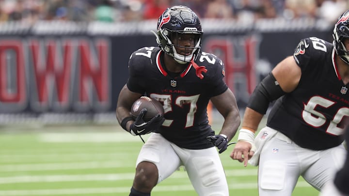 Sep 28, 2025; Houston, Texas, USA; Houston Texans running back Woody Marks (27) runs with the ball during the fourth quarter against the Tennessee Titans at NRG Stadium. Mandatory Credit: Troy Taormina-Imagn Images