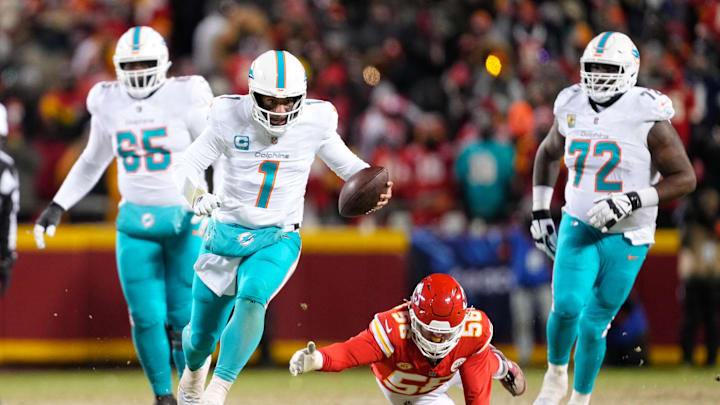 Jan 13, 2024; Kansas City, Missouri, USA; Miami Dolphins quarterback Tua Tagovailoa (1) runs the