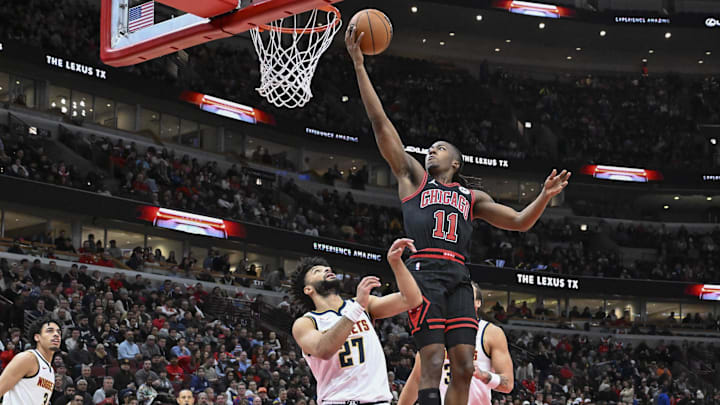 Jan 27, 2025; Chicago, Illinois, USA; Chicago Bulls guard Ayo Dosunmu (11) shoots over Denver Nuggets guard Jamal Murray (27) during the first half at the United Center. Mandatory Credit: Matt Marton-Imagn Images Jan 27, 2025; Chicago, Illinois, USA; Chicago Bulls guard Ayo Dosunmu (11) shoots over Denver Nuggets guard Jamal Murray (27) during the first half at the United Center. Mandatory Credit: Matt Marton-Imagn Images