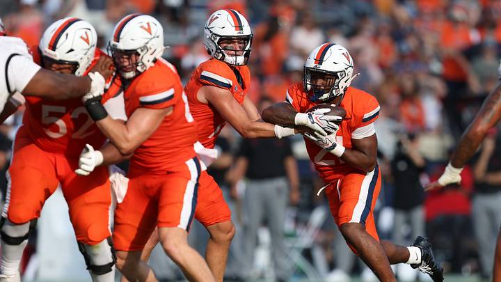 Aug 29, 2026; Charlottesville, Virginia, USA; Virginia Cavaliers quarterback Beau Pribula (7) hands off to running back Jekail Middlebrook (21) during the game against the North Carolina State Wolfpack at Scott Stadium. Mandatory Credit: Greg Atkins-Imagn Images Aug 29, 2026; Charlottesville, Virginia, USA; Virginia Cavaliers quarterback Beau Pribula (7) hands off to running back Jekail Middlebrook (21) during the game against the North Carolina State Wolfpack at Scott Stadium. Mandatory Credit: Greg Atkins-Imagn Images
