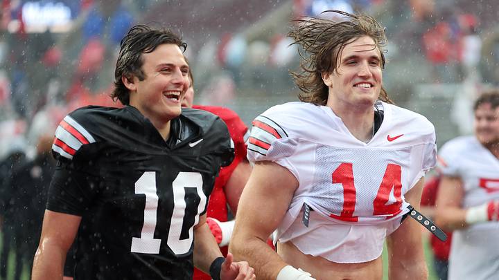 Apr 18, 2026; Columbus, OH, USA; Ohio State Quarterback Julian Sayin (10) and linebacker Christian Alliegro (14) sprint out of the rain storms following the second half as part of the annual spring game at Ohio Stadium. Mandatory Credit: Joseph Maiorana-Imagn Images Apr 18, 2026; Columbus, OH, USA; Ohio State Quarterback Julian Sayin (10) and linebacker Christian Alliegro (14) sprint out of the rain storms following the second half as part of the annual spring game at Ohio Stadium. Mandatory Credit: Joseph Maiorana-Imagn Images