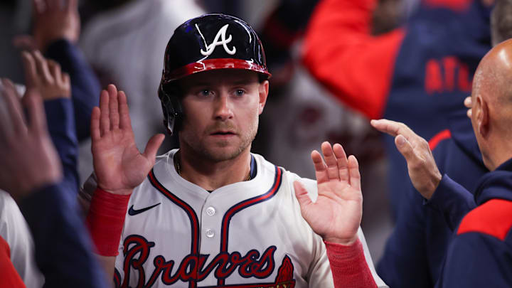 Atlanta Braves left fielder Jarred Kelenic (24) celebrates with teammates after scoring a run against the Philadelphia Phillies in the sixth inning at Truist Park on April 8.