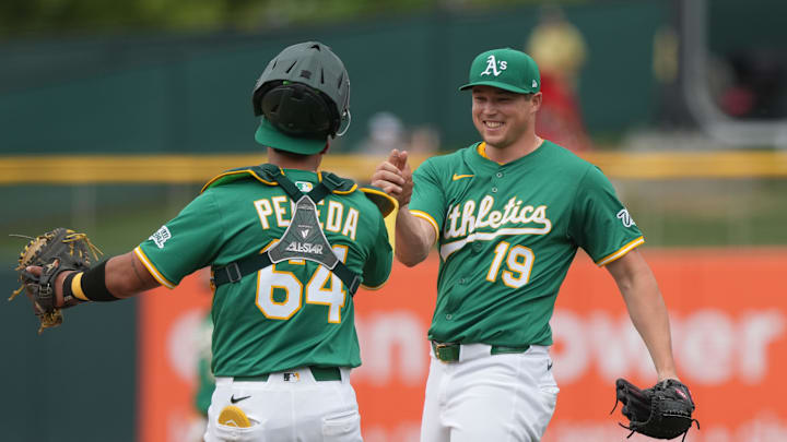 Jun 8, 2025; West Sacramento, California, USA; Athletics pitcher Mason Miller (19) celebrates with catcher Jhonny Pereda (64) after defeating the Baltimore Orioles at Sutter Health Park. Mandatory Credit: Darren Yamashita-Imagn Images Jun 8, 2025; West Sacramento, California, USA; Athletics pitcher Mason Miller (19) celebrates with catcher Jhonny Pereda (64) after defeating the Baltimore Orioles at Sutter Health Park. Mandatory Credit: Darren Yamashita-Imagn Images