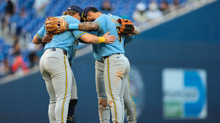 Apr 18, 2026; Miami, Florida, USA; Milwaukee Brewers shortstop Joey Ortiz (3) and first baseman Jake Bauers (9) celebrate with their teammates after the game against the Miami Marlins at loanDepot Park. Mandatory Credit: Sam Navarro-Imagn Images