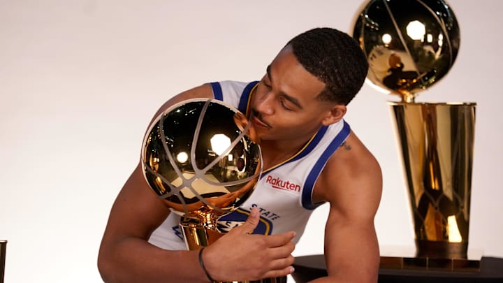 Sep 25, 2022; San Francisco, CA, USA; Golden State Warriors guard Jordan Poole (3) poses with the Larry O'Brien Championship Trophies during Media Day at the Chase Center. Mandatory Credit: Cary Edmondson-Imagn Images