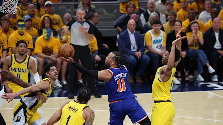 May 25, 2025; Indianapolis, Indiana, USA; New York Knicks guard Jalen Brunson (11) drives to the hoop past Indiana Pacers forward Obi Toppin (1) during the first quarter of game three of the Eastern Conference Finals for the 2025 NBA Playoffs at Gainbridge Fieldhouse. Mandatory Credit: Trevor Ruszkowski-Imagn Images