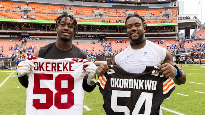 Ogbo Okoronkwo (left) poses with Bobby Okereke after a game between the Browns and Giants.