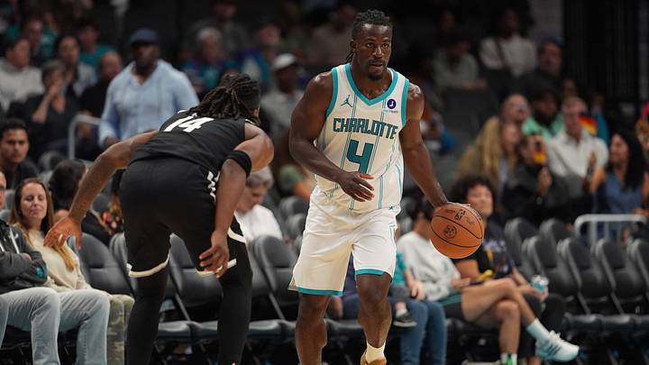 Charlotte Hornets guard Sion James (4) brings the ball up court guarded by Brooklyn Nets guard Terance Mann Charlotte Hornets guard Sion James (4) brings the ball up court guarded by Brooklyn Nets guard Terance Mann