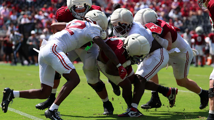 Apr 11, 2026; Tuscaloosa, AL, USA; Alabama Crimson Tide running back Daniel Hill (4) is taken down by linebacker Yhonzae Pierre (0) and defensive back Zavier Mincey (12) during the Alabama A-Day spring football scrimmage game at Saban Field at Bryant-Denny Stadium. Mandatory Credit: David Leong-Imagn Images Apr 11, 2026; Tuscaloosa, AL, USA; Alabama Crimson Tide running back Daniel Hill (4) is taken down by linebacker Yhonzae Pierre (0) and defensive back Zavier Mincey (12) during the Alabama A-Day spring football scrimmage game at Saban Field at Bryant-Denny Stadium. Mandatory Credit: David Leong-Imagn Images