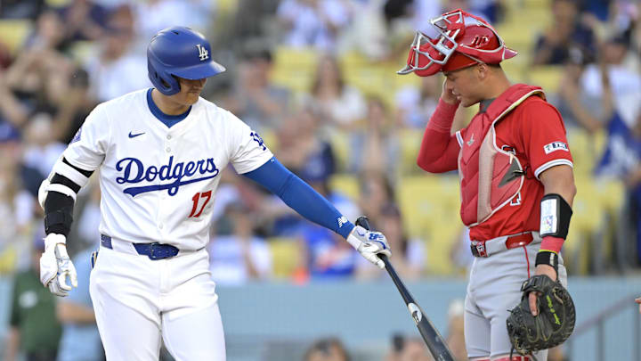 Jun 21, 2024; Los Angeles, California, USA;  Los Angeles Dodgers designated hitter Shohei Ohtani (17) greets Los Angeles Angels catcher Logan O'Hoppe (14) at the plate during his at bat in the first inning at Dodger Stadium. Mandatory Credit: Jayne Kamin-Oncea-Imagn Images