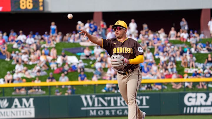 Feb 25, 2024; Mesa, Arizona, USA; San Diego Padres infielder Marcos Castanon (97) makes the out at first in the eighth inning during a spring training game at Sloan Park against the Chicago Cubs. Mandatory Credit: Allan Henry-Imagn Images