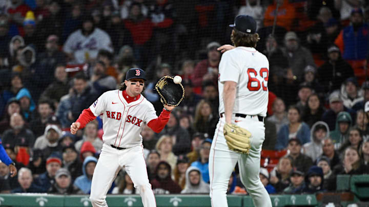 May 19, 2025; Boston, Massachusetts, USA; Boston Red Sox relief pitcher Justin Slaten (63) throws the ball to first baseman Nick Sogard (20) for an out against the New York Mets during the eighth inning at Fenway Park. Mandatory Credit: Eric Canha-Imagn Images