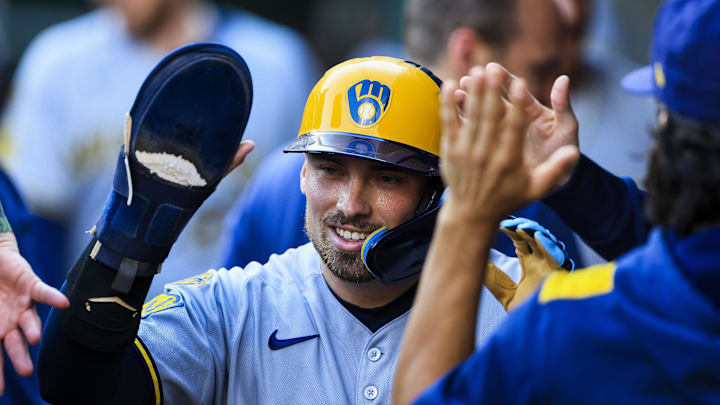 Aug 16, 2025; Cincinnati, Ohio, USA; Milwaukee Brewers third baseman Caleb Durbin (21) high fives teammates after scoring on a RBI double hit by second baseman Brice Turang (not pictured) in the second inning against the Cincinnati Reds at Great American Ball Park. Mandatory Credit: Katie Stratman-Imagn Images Aug 16, 2025; Cincinnati, Ohio, USA; Milwaukee Brewers third baseman Caleb Durbin (21) high fives teammates after scoring on a RBI double hit by second baseman Brice Turang (not pictured) in the second inning against the Cincinnati Reds at Great American Ball Park. Mandatory Credit: Katie Stratman-Imagn Images